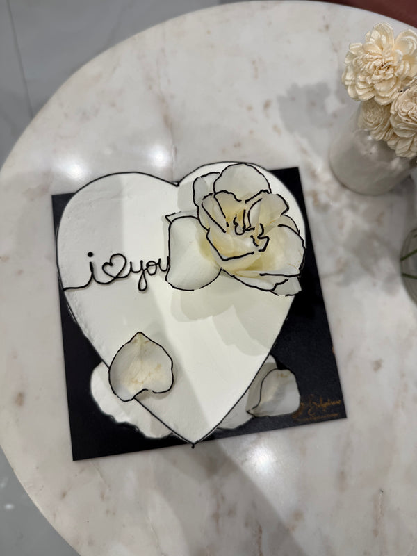 A minimal Belgstrew Korean 3D Heart White Cake with sculpted heart texture and smooth chocolate truffle inside.