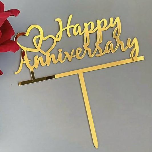 Gold 'Happy Anniversary' cake topper with a red rose on a light gray background