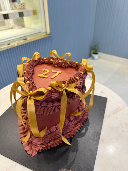 Heart-Shaped 2 Kg Hazelnut Praline Chocolate Cake with Golden Ribbons – Elegant Celebration Cake