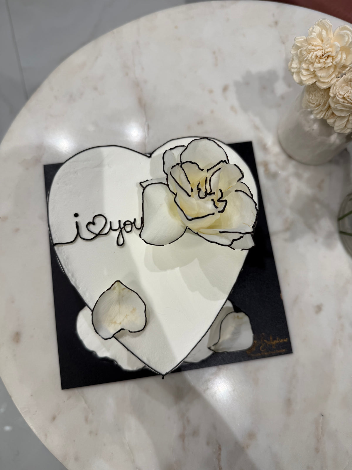 A minimal Belgstrew Korean 3D Heart White Cake with sculpted heart texture and smooth chocolate truffle inside.