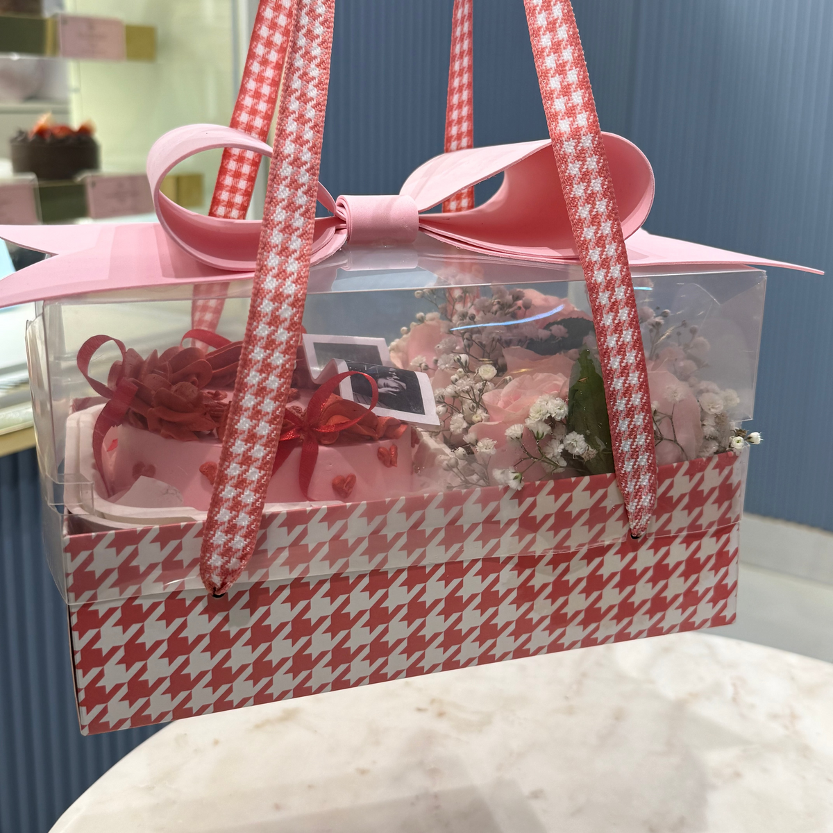 A Belgstrew Mon Amour Bow Box Bento Cake with an elegant satin bow design and romantic frosting details.