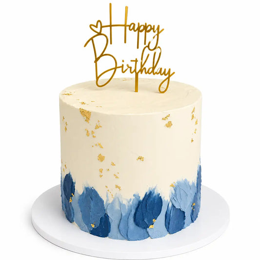 A tall round premium birthday cake for him with smooth white cream frosting on top, decorated with abstract blue palette knife strokes at the base and delicate gold leaf details as seen in image.