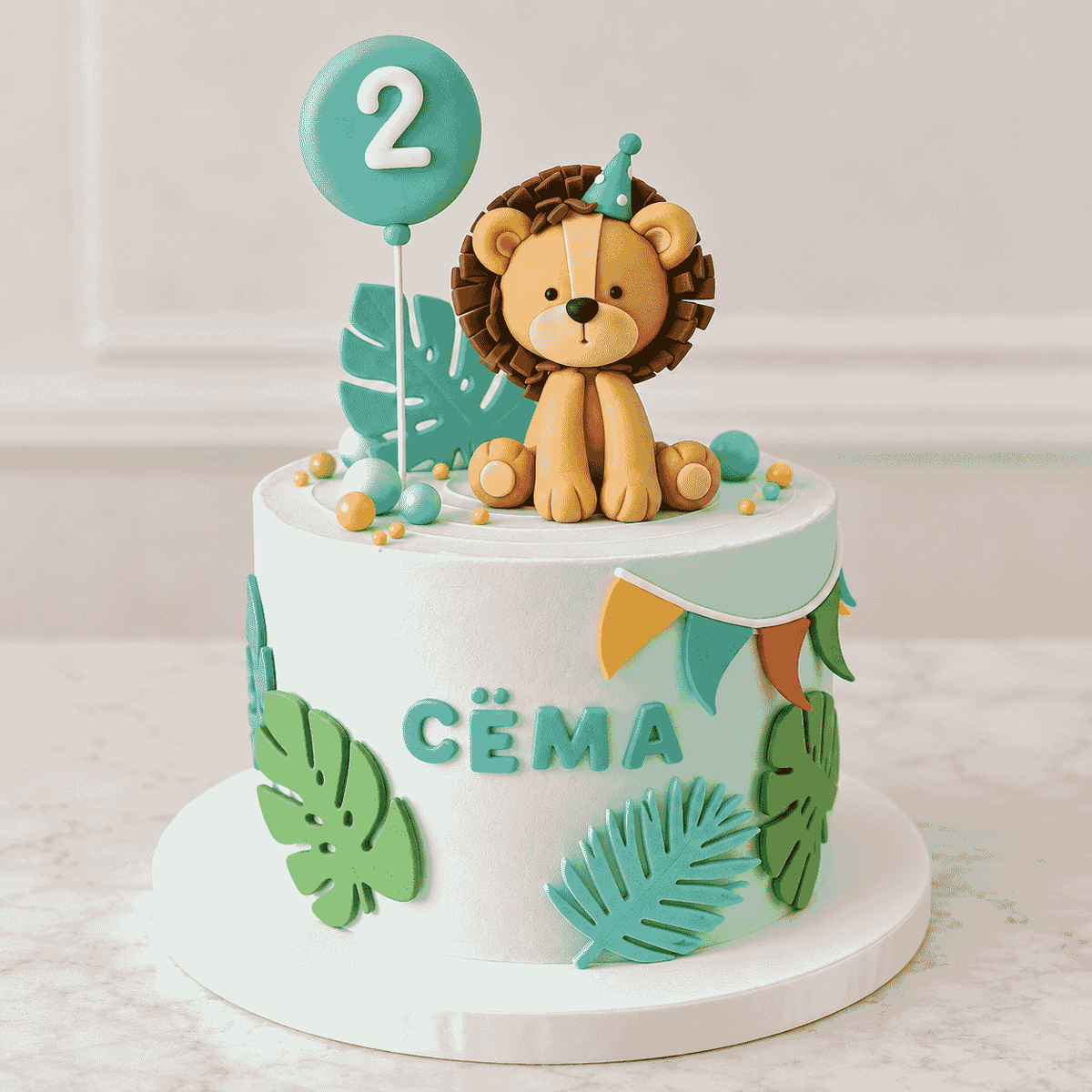 A pastel mint green round birthday cake with a handcrafted fondant baby lion topper wearing a party hat, palm leaves, bunting flags, and a number two balloon topper.